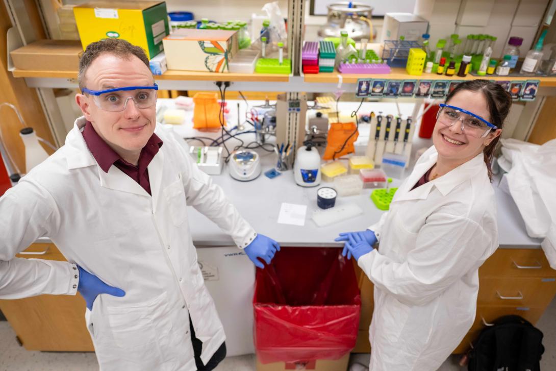 Laverty and a student pose for a photo in the lab